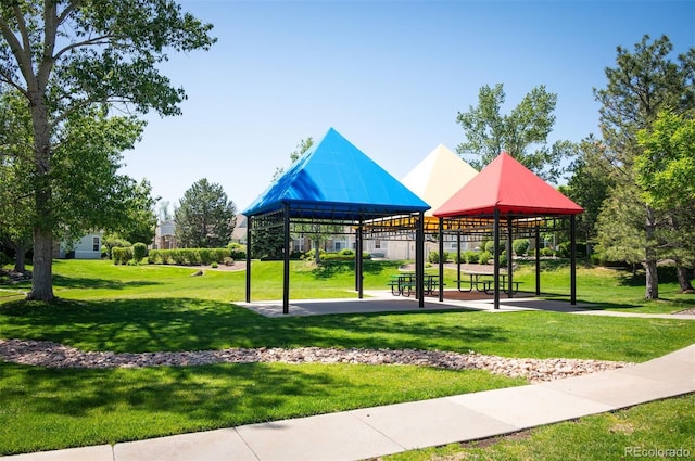 surrounding community with a gazebo and a lawn