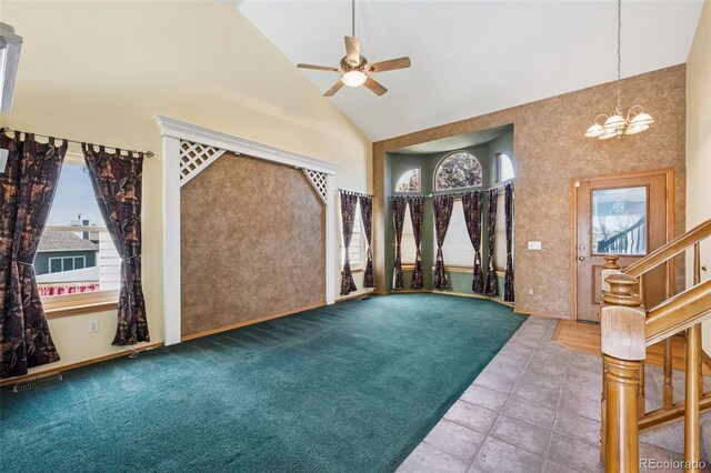 6510 Packsaddle Ct, Colorado Springs, CO 80922 - entryway with high vaulted ceiling, a ceiling fan, a chandelier, plenty of natural light, and stairway