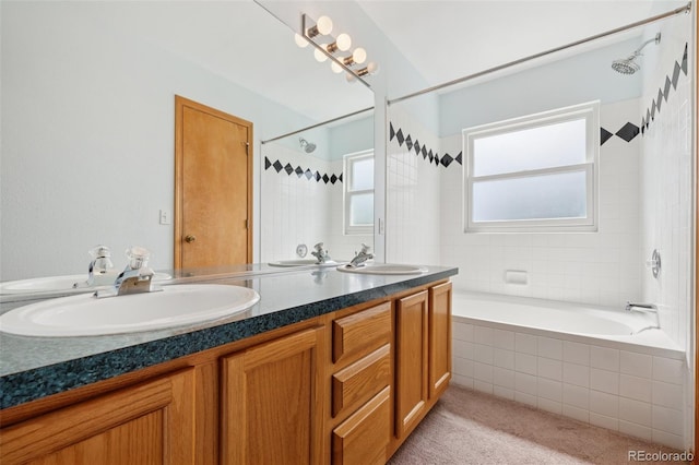 6510 Packsaddle Ct, Colorado Springs, CO 80922 - bathroom featuring double vanity and tiled shower / bath combo