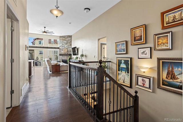 13833 Rivercrest Cir, Colorado Springs, CO 80921 - hallway with hardwood / wood-style floors, high vaulted ceiling, and an upstairs landing