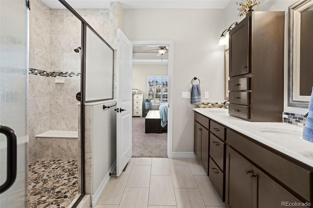 13833 Rivercrest Cir, Colorado Springs, CO 80921 - full bath with a stall shower, ceiling fan, ensuite bathroom, and double vanity