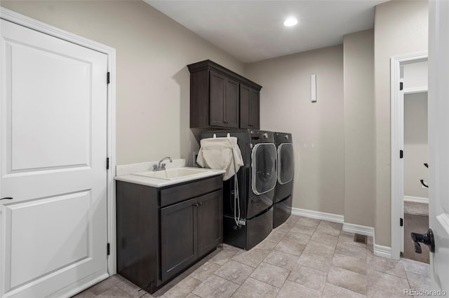 13833 Rivercrest Cir, Colorado Springs, CO 80921 - washroom featuring separate washer and dryer, cabinet space, baseboards, and recessed lighting