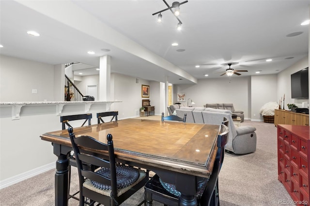13833 Rivercrest Cir, Colorado Springs, CO 80921 - dining area with baseboards, light colored carpet, a ceiling fan, and recessed lighting