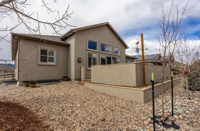 13833 Rivercrest Cir, Colorado Springs, CO 80921 - back of property featuring stucco siding and roof with shingles