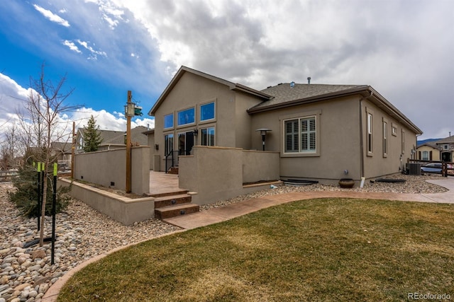 13833 Rivercrest Cir, Colorado Springs, CO 80921 - rear view of house featuring stucco siding and central air condition unit