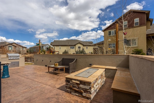 13833 Rivercrest Cir, Colorado Springs, CO 80921 - view of patio / terrace featuring an outdoor fire pit and a residential view