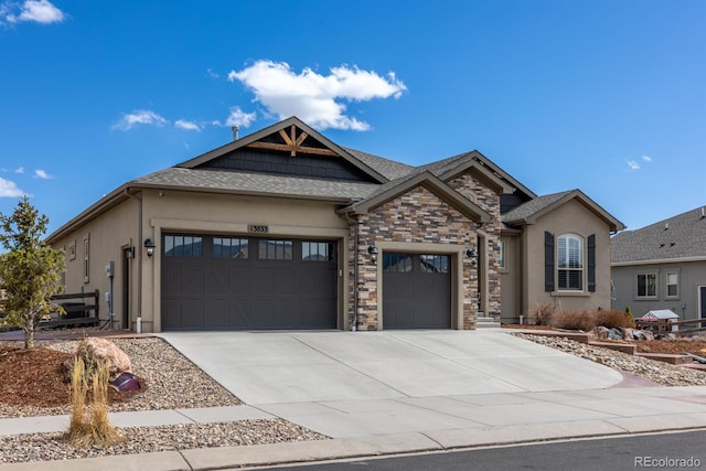 13833 Rivercrest Cir, Colorado Springs, CO 80921 - view of front of house featuring stucco siding, an attached garage, concrete driveway, and stone siding