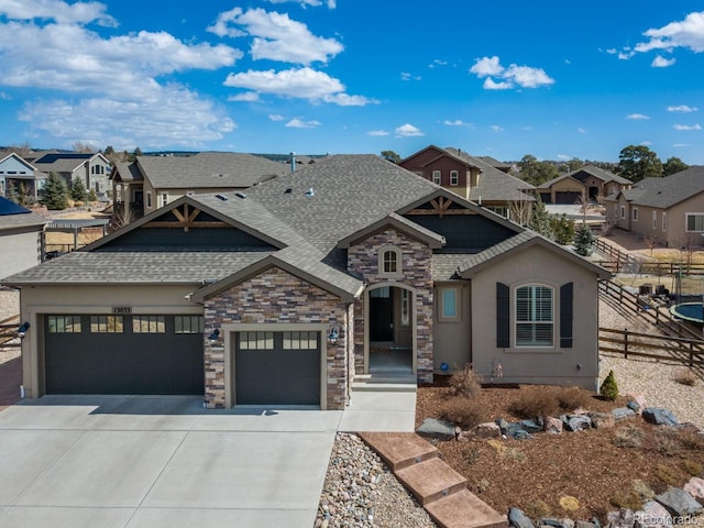 13833 Rivercrest Cir, Colorado Springs, CO 80921 - view of front facade featuring roof with shingles, a garage, concrete driveway, and a residential view