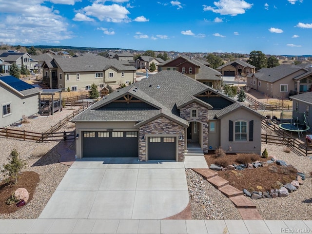 13833 Rivercrest Cir, Colorado Springs, CO 80921 - view of front of home featuring a residential view, a garage, driveway, stone siding, and a shingled roof