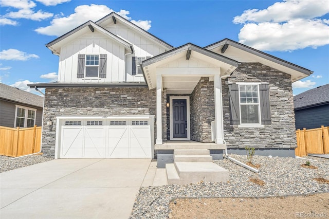 6207 E 155th Pl, Brighton, CO 80602 - craftsman-style house with fence, an attached garage, stone siding, concrete driveway, and board and batten siding