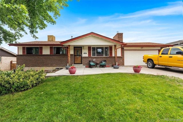 6336 W 71st Pl, Arvada, CO 80003 - ranch-style house featuring a chimney, brick siding, a garage, and a front yard