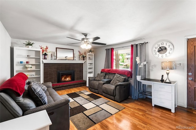 6336 W 71st Pl, Arvada, CO 80003 - living area featuring ceiling fan, wood finished floors, and a fireplace