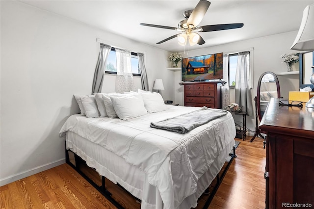 6336 W 71st Pl, Arvada, CO 80003 - bedroom with wood finished floors and ceiling fan