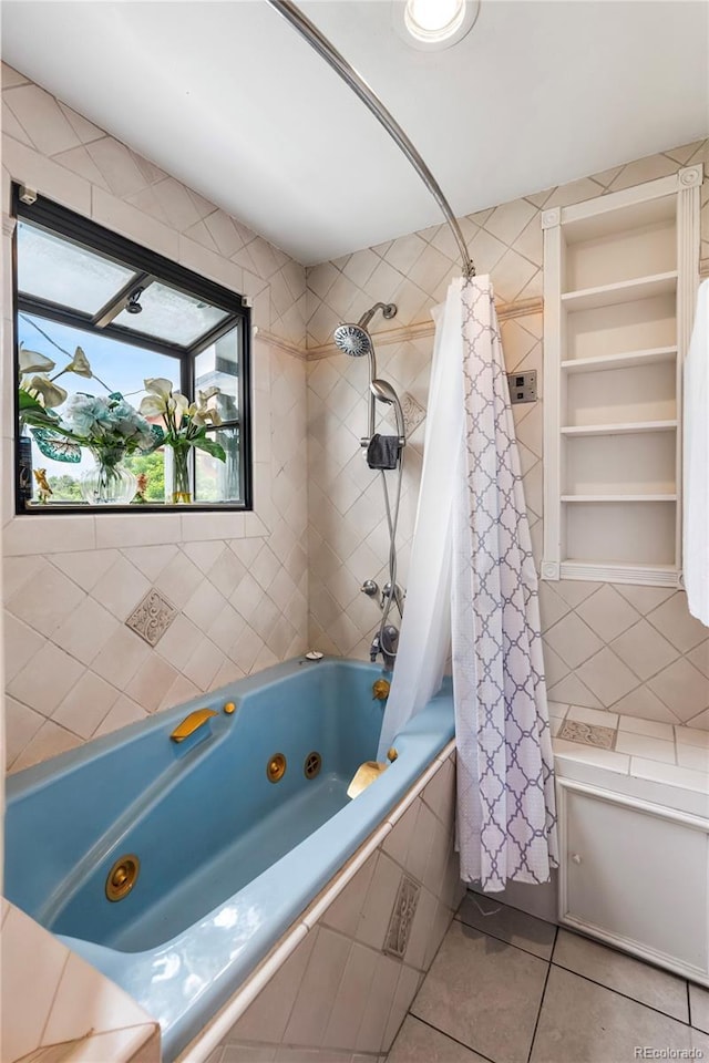 6336 W 71st Pl, Arvada, CO 80003 - bathroom with tile patterned floors, a combined bath / shower with jetted tub, and tile walls