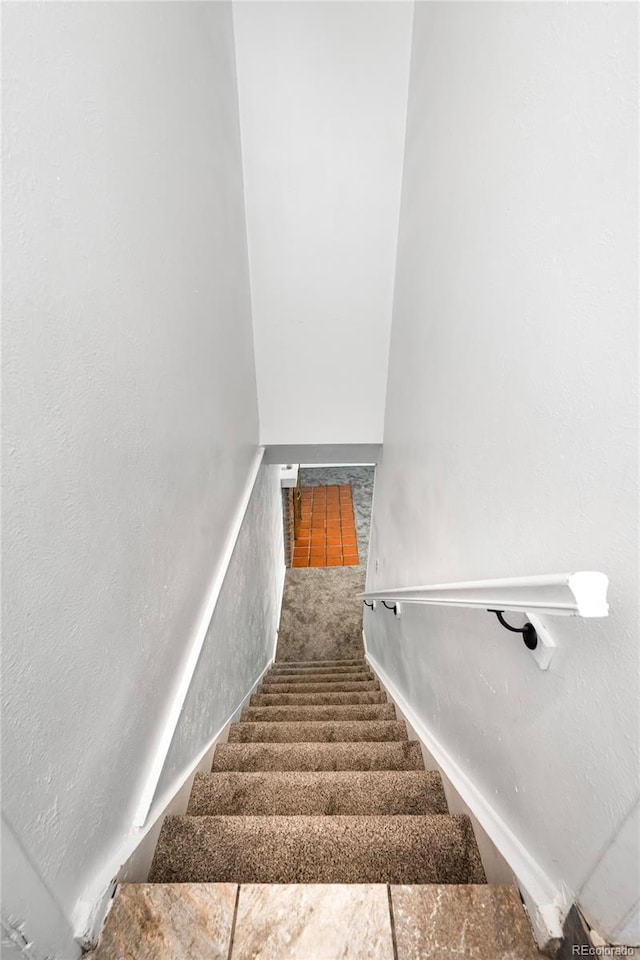 6336 W 71st Pl, Arvada, CO 80003 - staircase featuring carpet flooring