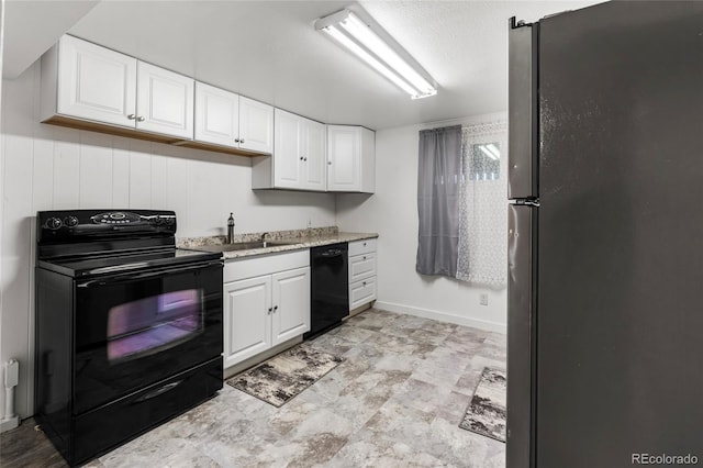 6336 W 71st Pl, Arvada, CO 80003 - kitchen featuring black appliances, white cabinetry, and light stone counters