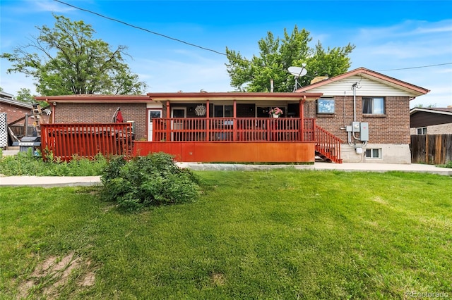 6336 W 71st Pl, Arvada, CO 80003 - rear view of property with brick siding and a wooden deck