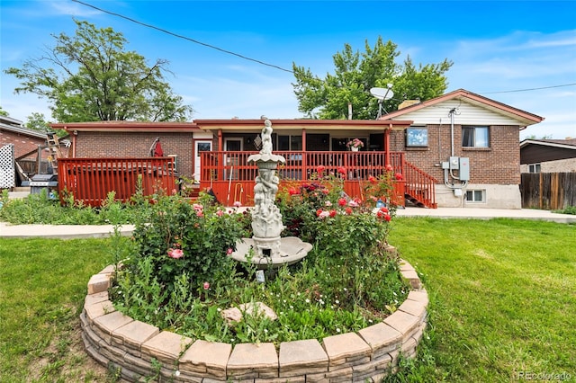 6336 W 71st Pl, Arvada, CO 80003 - back of house featuring brick siding and a wooden deck