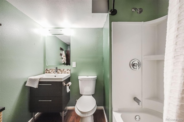 full bathroom with toilet, vanity, wood-type flooring, shower / bath combination, and a textured ceiling