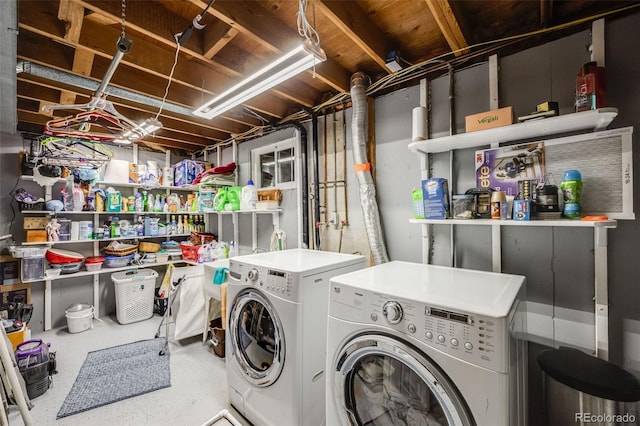 clothes washing area with washer and dryer