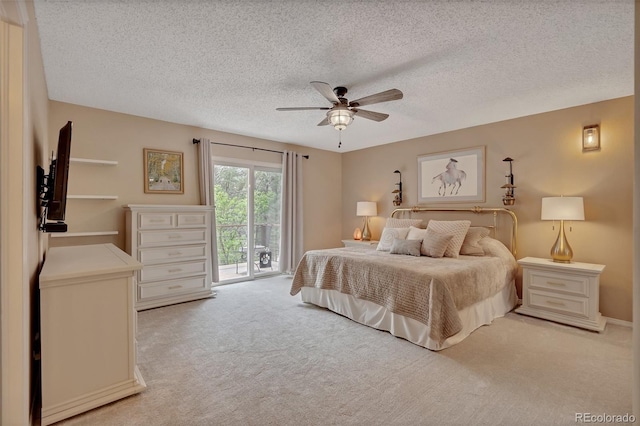 1540 Fawnwood Rd, Monument, CO 80132 - bedroom featuring access to outside, light carpet, a textured ceiling, and ceiling fan