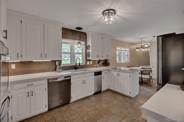 1540 Fawnwood Rd, Monument, CO 80132 - kitchen featuring stainless steel appliances, a sink, a peninsula, and healthy amount of natural light