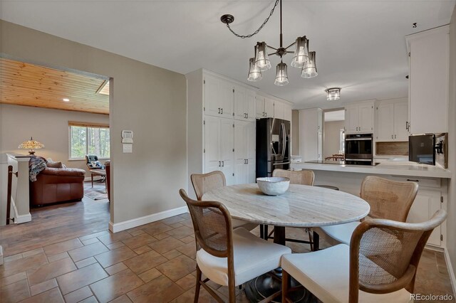 1540 Fawnwood Rd, Monument, CO 80132 - dining area featuring baseboards and stone finish flooring
