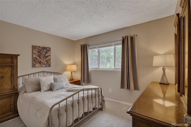 1540 Fawnwood Rd, Monument, CO 80132 - bedroom with carpet, a textured ceiling, and baseboards