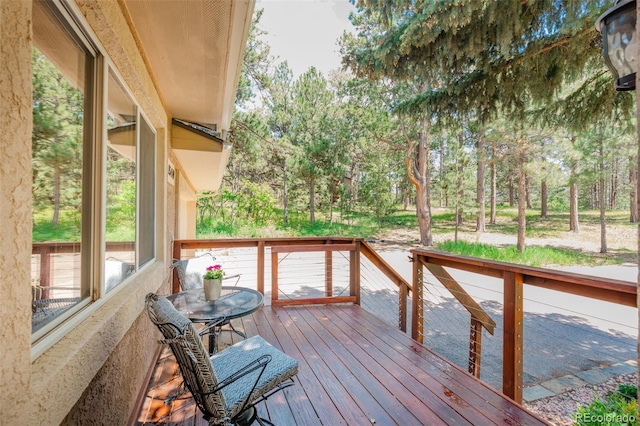 1540 Fawnwood Rd, Monument, CO 80132 - wooden terrace featuring view of wooded area