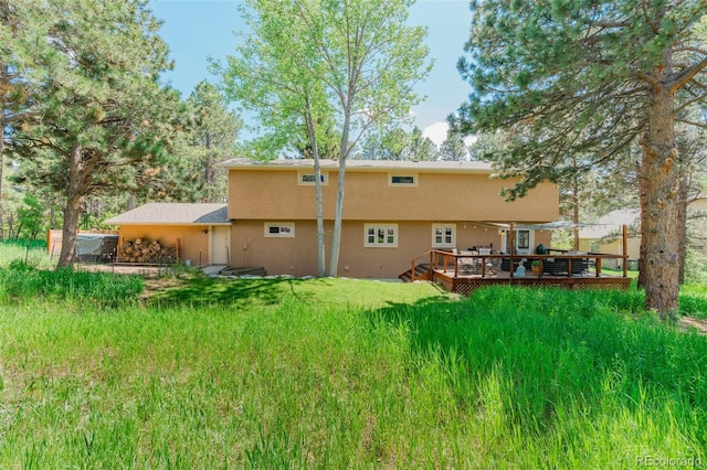 1540 Fawnwood Rd, Monument, CO 80132 - back of house with a wooden deck and stucco siding