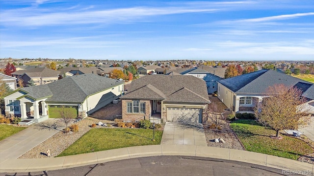 view of front of home with a garage and a front lawn