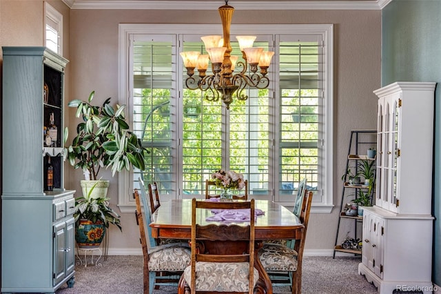 dining area with baseboards, carpet, and a notable chandelier