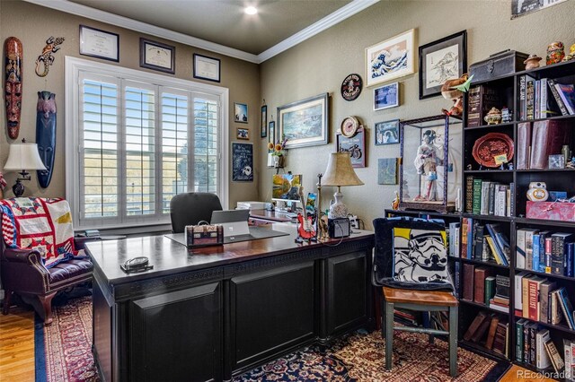 home office featuring ornamental molding and wood finished floors