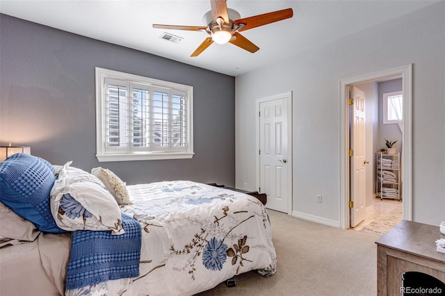 bedroom featuring visible vents, baseboards, a ceiling fan, and carpet floors