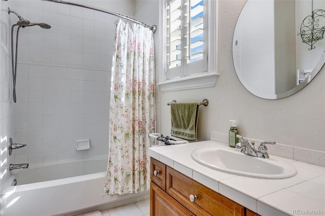 full bath with shower / tub combo, vanity, and tile patterned floors