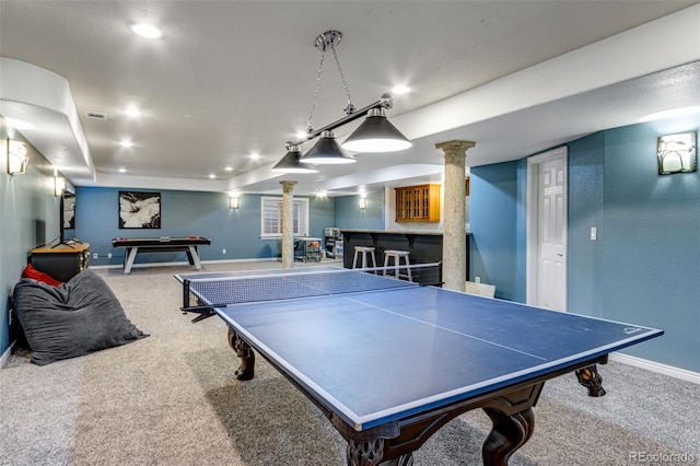 rec room with visible vents, baseboards, decorative columns, bar area, and carpet flooring