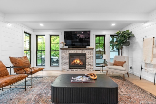 3235 E Easter Pl, Centennial, CO 80122 - living room with wood finished floors, a brick fireplace, wood walls, beamed ceiling, and recessed lighting