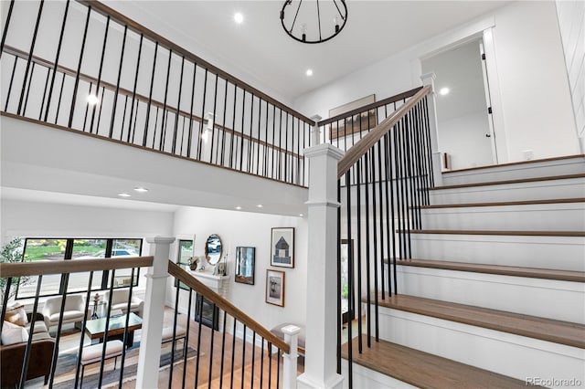 3235 E Easter Pl, Centennial, CO 80122 - stairs with a high ceiling, recessed lighting, wood finished floors, and a chandelier