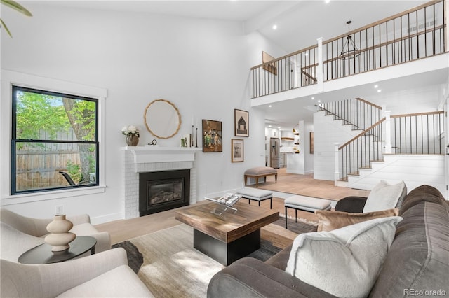 3235 E Easter Pl, Centennial, CO 80122 - living room with stairs, high vaulted ceiling, a fireplace, baseboards, and recessed lighting