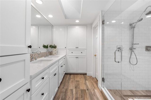 3235 E Easter Pl, Centennial, CO 80122 - bathroom featuring recessed lighting, a shower stall, vanity, and wood finished floors