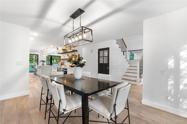 3235 E Easter Pl, Centennial, CO 80122 - dining space with baseboards, stairs, a chandelier, light wood-style flooring, and recessed lighting