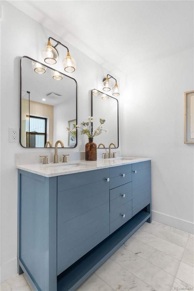 3235 E Easter Pl, Centennial, CO 80122 - full bathroom featuring double vanity and baseboards
