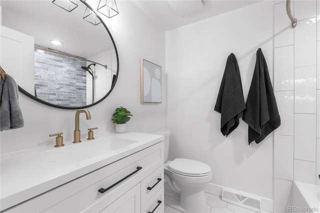 3235 E Easter Pl, Centennial, CO 80122 - full bath featuring vanity, toilet, tile patterned floors, washtub / shower combination, and baseboards