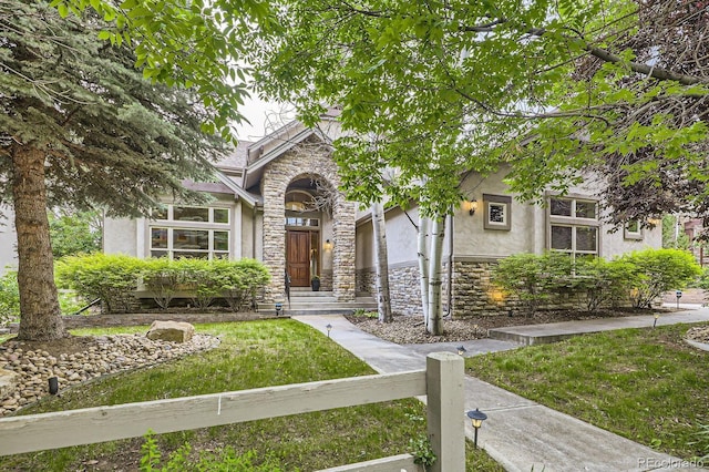 714 Skywalker Pt, Lafayette, CO 80026 - view of front of home with stone siding and stucco siding