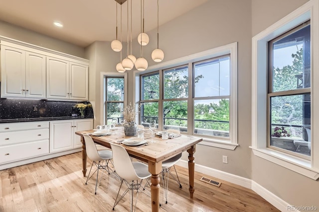 714 Skywalker Pt, Lafayette, CO 80026 - dining space featuring healthy amount of natural light, light wood finished floors, and recessed lighting