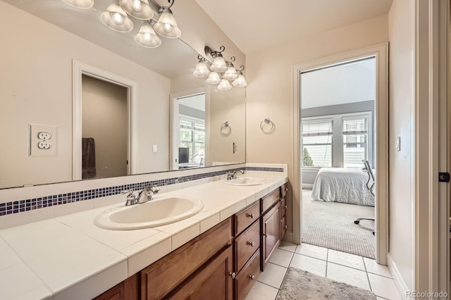 714 Skywalker Pt, Lafayette, CO 80026 - bathroom featuring ensuite bath, double vanity, plenty of natural light, and tile patterned flooring