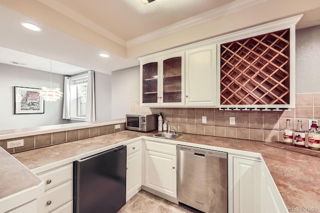 714 Skywalker Pt, Lafayette, CO 80026 - kitchen with stainless steel appliances, ornamental molding, decorative backsplash, a peninsula, and glass insert cabinets