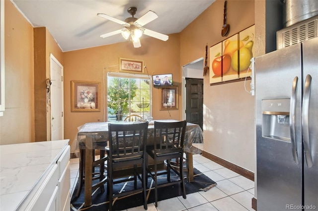 dining space with ceiling fan and light tile patterned floors