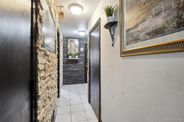 hall featuring light tile patterned floors