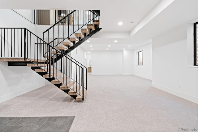 staircase with carpet floors